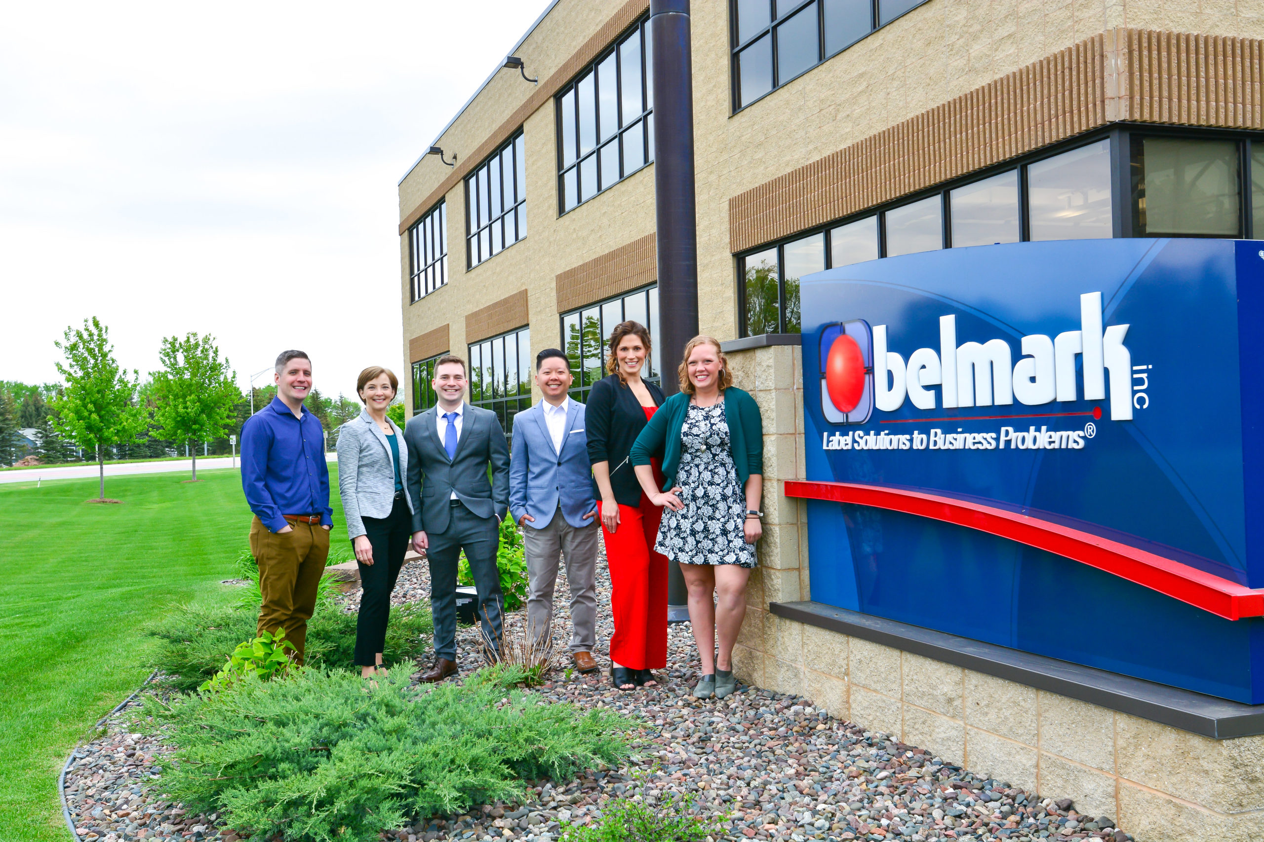 Belmark- Team Next to Company Logo