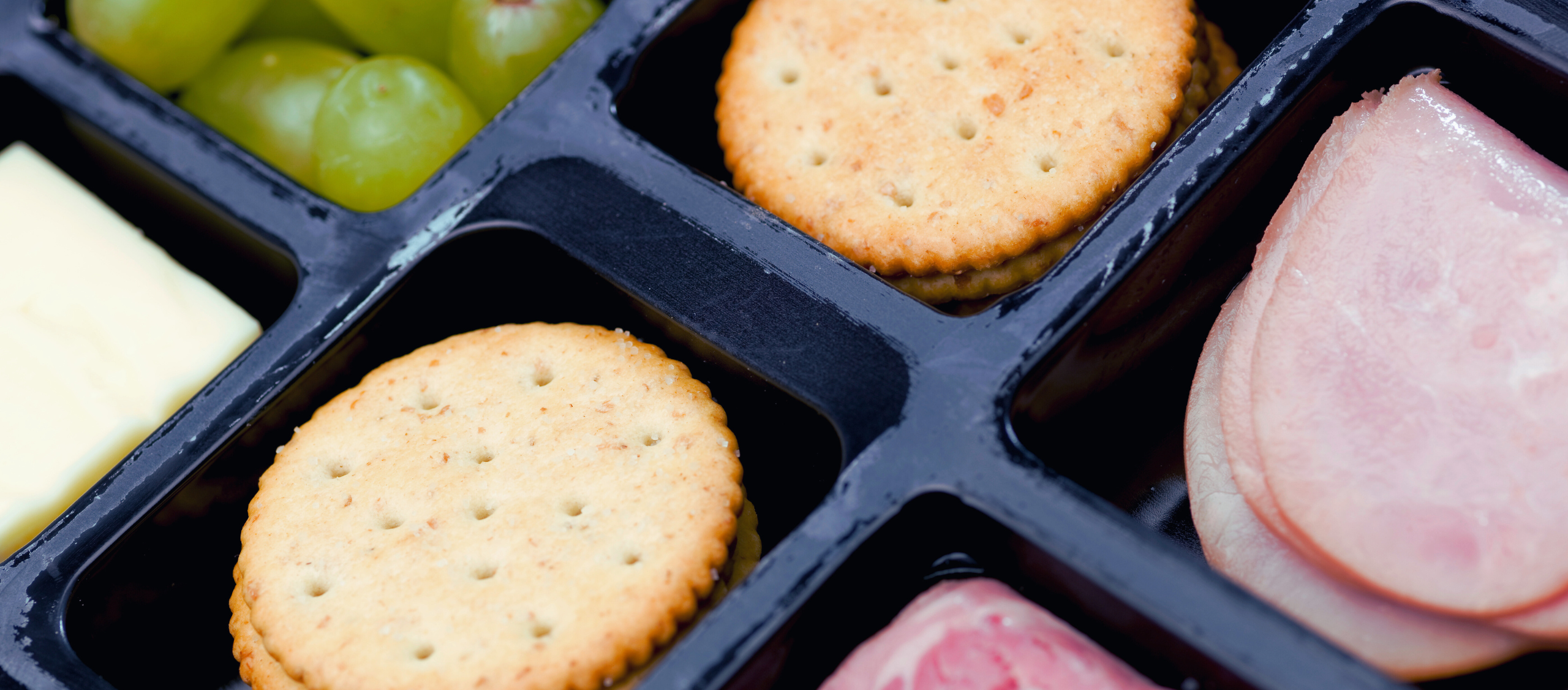 Snack tray with meat and cheese perfect for lidding film.