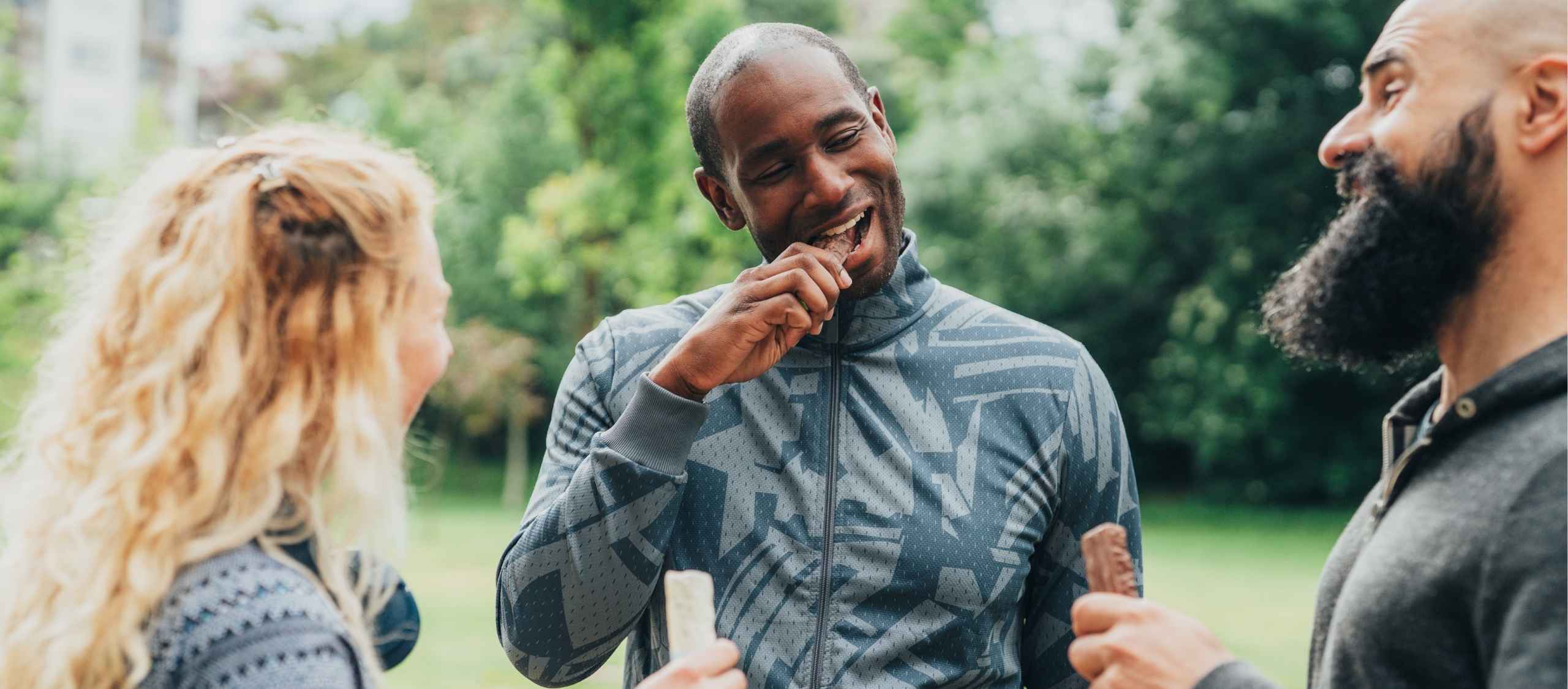 People after a workout eating a protein bar