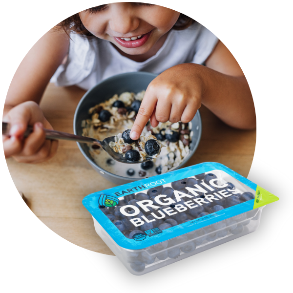 Blueberries in lidding film next to a picture of a child eating bluberries in their cereal.