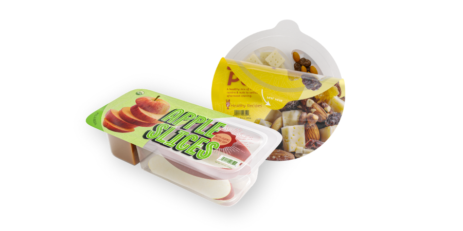 Apples slices and cheese snack in tray with lidding film.