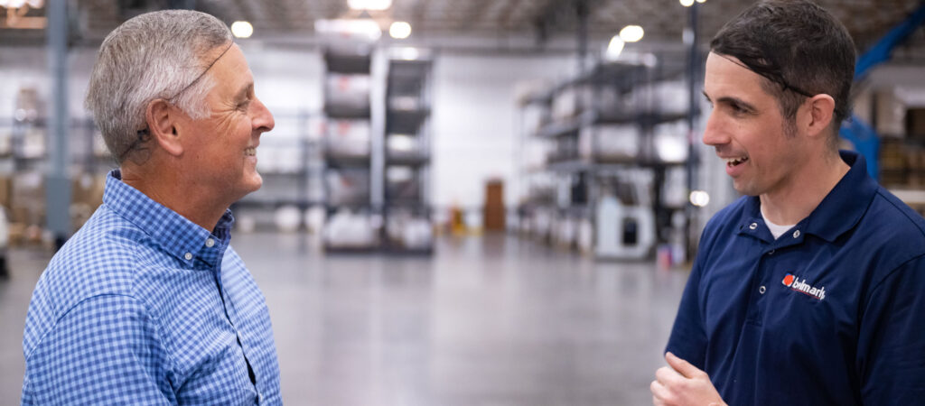 Belmark employee talking with a packaging customer