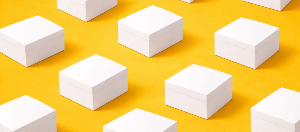 white folding cartons on yellow background