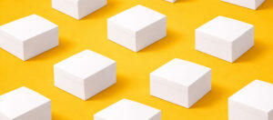 white folding cartons on yellow background