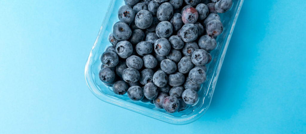 blueberries in a package with a blue background
