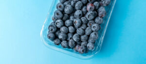 blueberries in a package with a blue background
