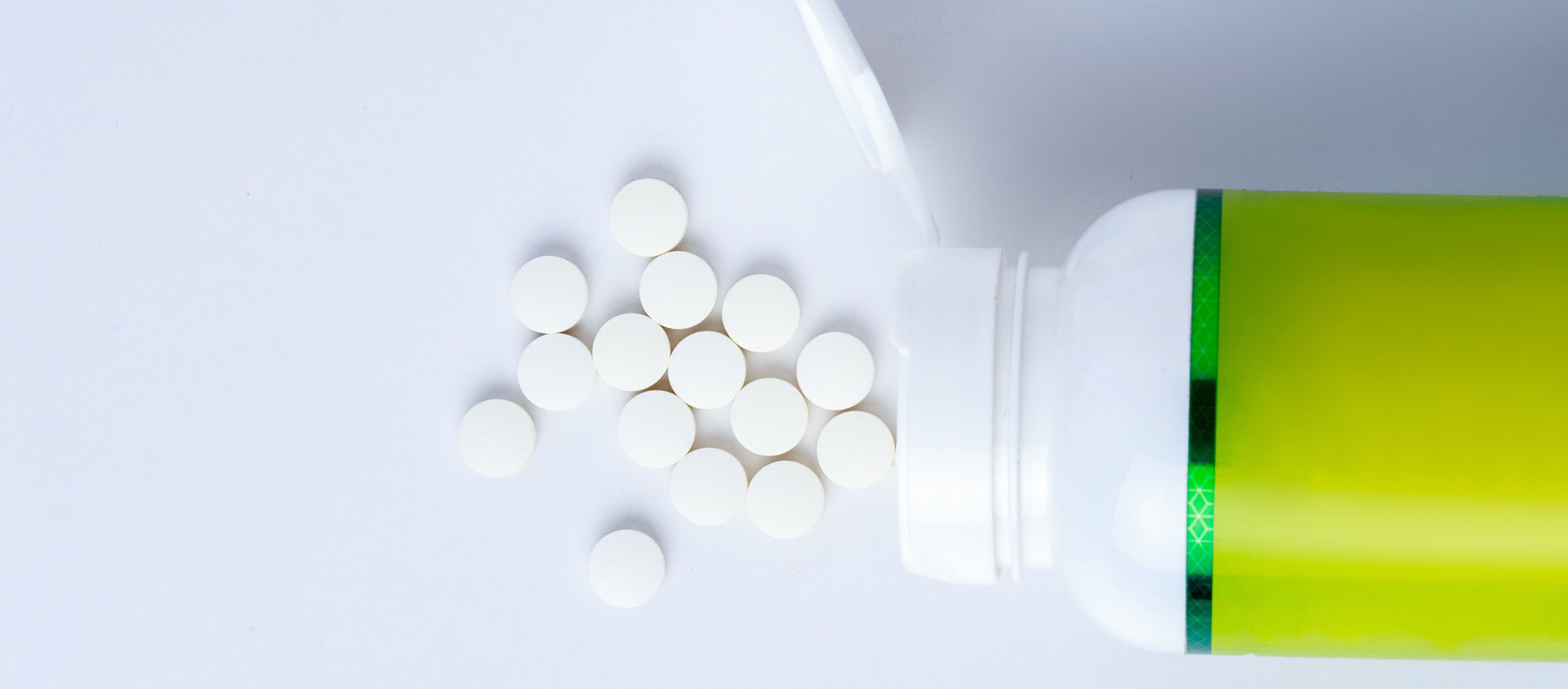 nutraceutical bottle with green pressure sensitive label